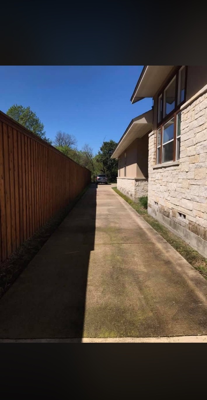 Before side driveway power washing in Dallas Texas